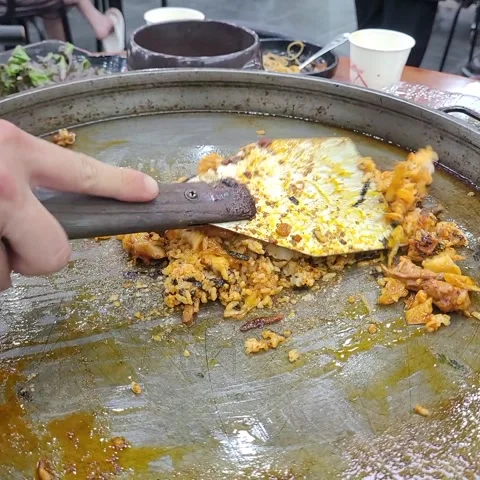 Preparing Korean Style Fried Rice (Bokkeumbap) with Leftover Dakgalbi on a Large Video stock 323159228