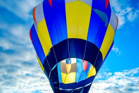 Preparing to launch a hot air balloon at dawn at a balloon festival in centra Stock Photos