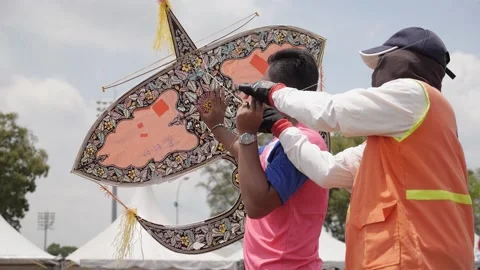 Preparing to Launch Malaysian Traditional Kite Wau Bulan at the Kite Festival Stock Footage 156767268