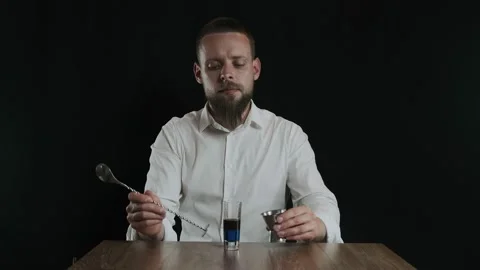 Preparing of Lexus Cocktail. Bartender pouring sambuca into a glass Stock Footage 132727328