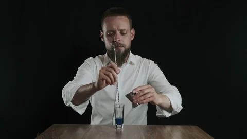 Preparing of Lexus Cocktail. Bartender pouring coffee liquor into a glass Stock Footage 132767578