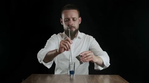 Preparing of Lexus Cocktail. Bartender pouring coffee liquor into a glass Stock Footage 133971038