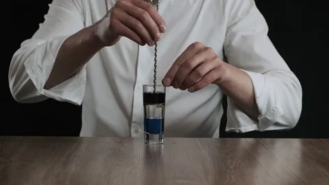 Preparing of Lexus Cocktail. Close up pouring coffee liquor into a glass Stock Footage 132716466