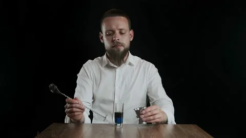 Preparing of Lexus Cocktail. Close up pouring sambuca into a glass Stock Footage 133971561