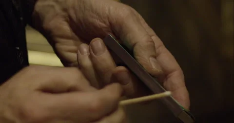 Preparing to light a match stick Stock Footage 56917096