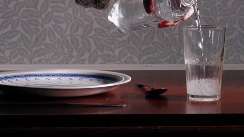 Preparing lunch pouring water for single person Stock Footage 255727422