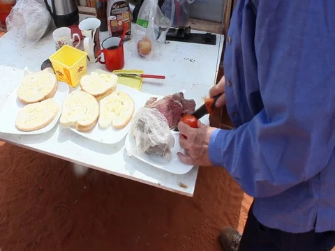 Preparing lunch ON THE ROAD SIDE Stock Footage 100410377