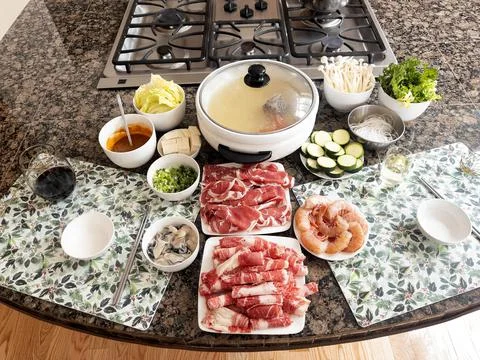 Preparing to make hot pot dinner in home kitchen Stock Photos