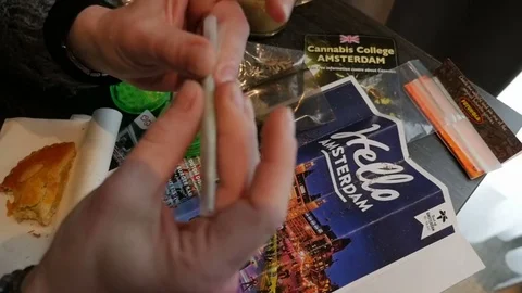 Preparing a marijuana joint, Amsterdam Stock Footage 74163380