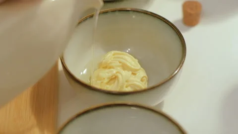 Preparing marinade for meat in the kitchen. Pouring oil into mayonnaise Stock Footage 256454275