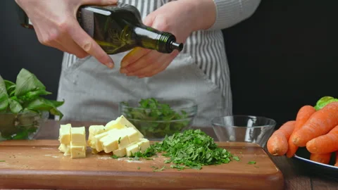 Preparing a marinade for Roast Chicken made from spices, basil leaves, parsley. Stock Footage 145106073