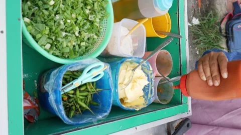 Preparing Martabak Telor. Savoury pan-fried pastry stuffed with egg, meat a.. Stock Footage 308648300