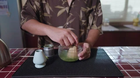 Preparing Matcha Tea Latte at home making this traditional Japanese drink. Stock Footage 311646639
