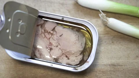 Preparing a meal with canned cod liver and spring onions 库存影片 336886879