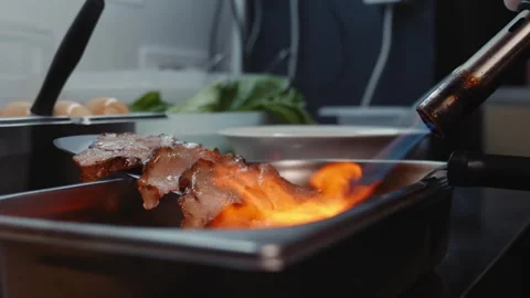 Preparing Meat with a Gas Torch Slow Motion Video stock 340194187
