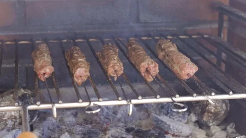 Preparing meat on grill on fire Stock Footage 116737188