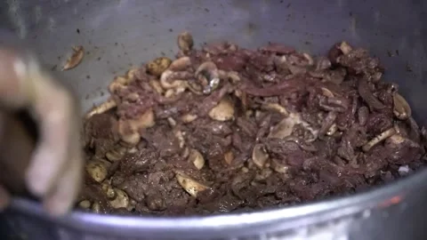 Preparing Meat with Mushrooms Stock Footage 319949412