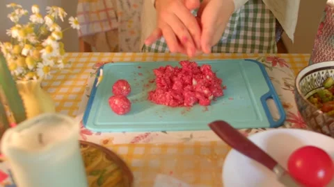 Preparing meatballs quickly, crafting round meatballs efficiently Stock Footage 320956789
