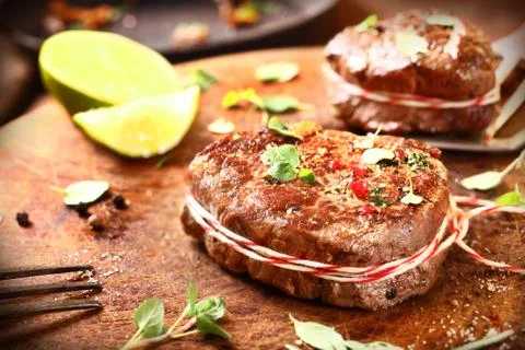 Preparing medallions of beef steak Stock Photos