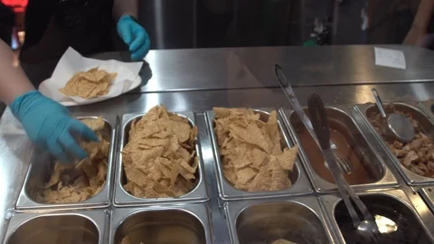 Preparing Mexican Burrito for customer. Video stock 107068499