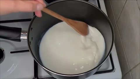 Preparing  milk for cake Stock Footage 171750813
