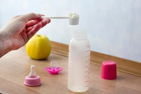 Preparing milk for a child Photos