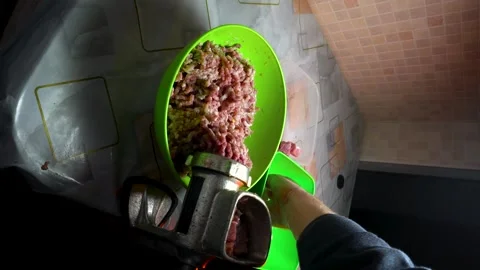 Preparing minced meat with a manual meat grinder Stock Footage 305648597