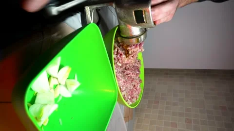 Preparing minced meat with a manual meat grinder Stock Footage 305648696