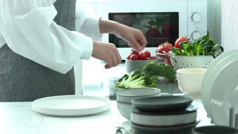 Preparing Mixed Vegetables in Kitchen Stock Footage 334280233