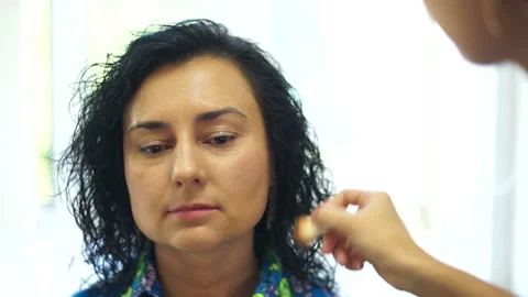 Preparing the model for makeup Stock Footage 98481703