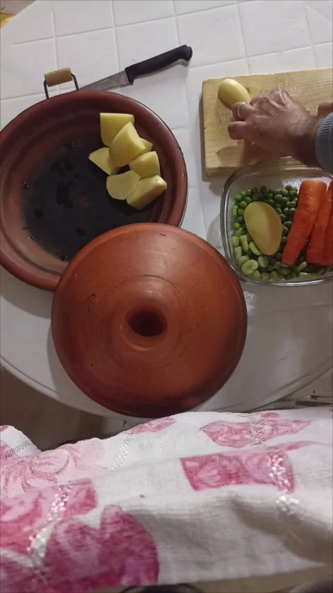 Preparing Moroccan Tagine - Slicing Fresh Potatoes for Traditional Stew Stock-Footage 333682531