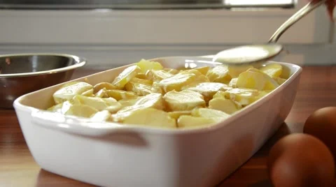 Preparing moussaka in a ceramic baking dish Stock Footage 43279735