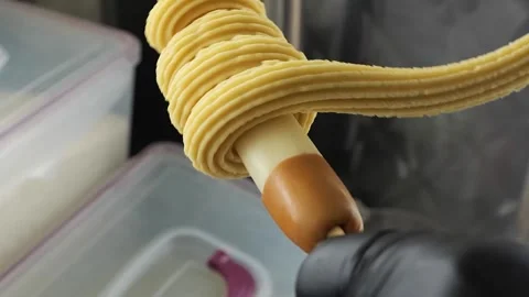 Preparing Mozzarella Cheese Churro Hot Dog on a Stick Stock Footage 331955910