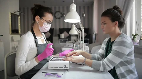 Preparing Nail To Manicure. Master Uses Special Spray For Client Nails In Salon Stock Footage 107473309