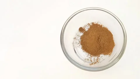 Preparing Natural Henna Paste in Glass Bowl on White Background, Mehndi Stock Footage 338233183