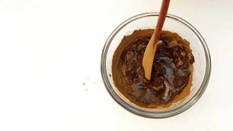 Preparing Natural Henna Paste in Glass Bowl on White Background, Mehndi Video stock 338233192