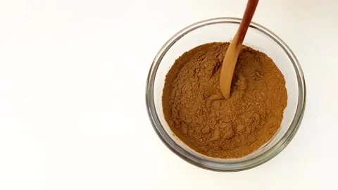 Preparing Natural Henna Paste in Glass Bowl on White Background, Mehndi Stock Footage 338233205
