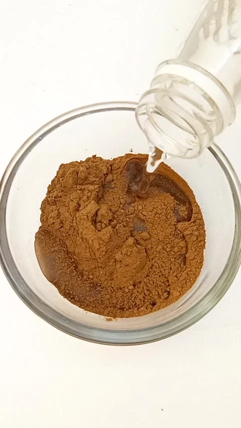 Preparing Natural Henna Paste in Glass Bowl on White Background, Henna Paste Stock Footage 339536254