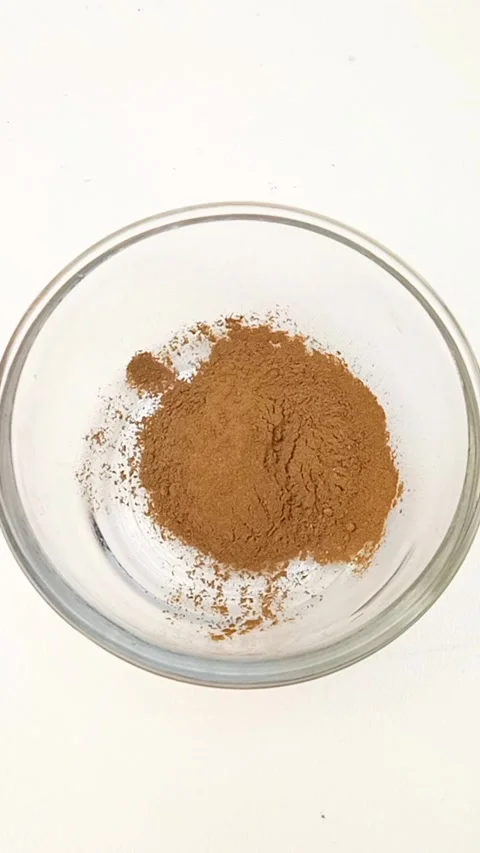 Preparing Natural Henna Paste in Glass Bowl on White Background, Henna Paste Stock Footage 339536320