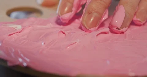 Preparing a new drawing color mix using bare hand Stock Footage 126982764