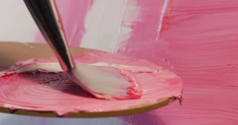 Preparing a new drawing color mix using white and pink colors Stock Footage 126983012