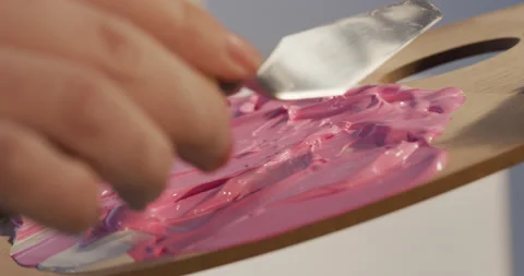 Preparing a new drawing color mix using small spatula Stock Footage 130962167