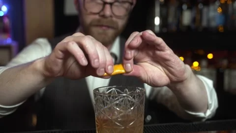 Preparing Old Fashioned Whiskey Alcohol Cocktail in a Bar. Stock Footage 131544528