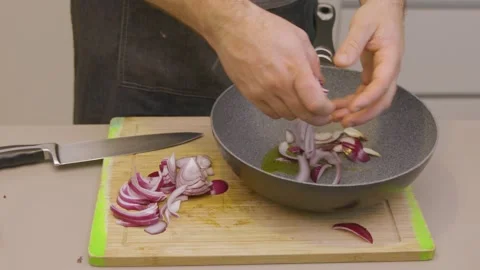 Preparing onions for frying Stock Footage 145648239