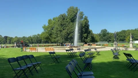 Preparing for an open-air concert in the courtyard of an old palace by the fount Stock Footage 165755830