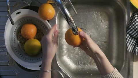 Preparing oranges to eat Stock Footage 262311322
