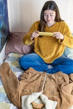 Preparing an order, selling second hand clothes on the Internet Stock Photos