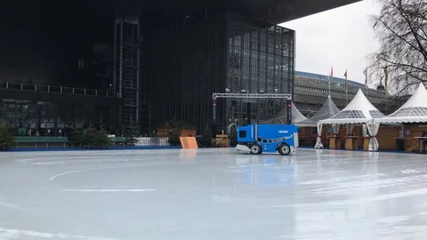 Preparing Outdoor Ice Rink with a Machine in Lucerne, Switzerland Stock Footage 122081709