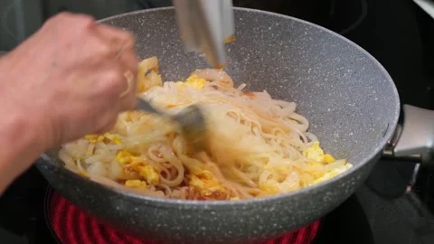 Preparing Pad Thai Kit with Rice Noodles Shrimp and Eggs in Wok Video stock 328364843