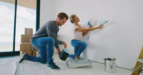 Preparing to paint their new home Stock Footage 101855128